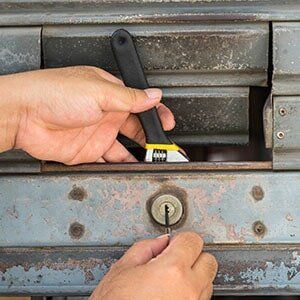 locksmith installing a lock with wrench