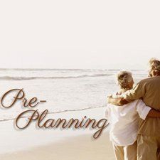 Couple walking arm-in-arm on a sunny beach with “Pre-Planning” text overlay