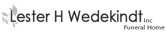 Lester H. Wedekind funeral home logo with text and leaf graphic