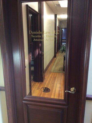 Door to a law office; text on glass panel says 