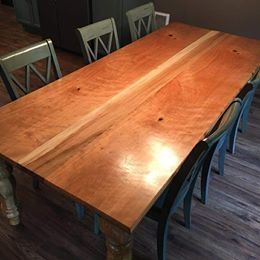 Wooden dining table with benches in a kitchen or dining room