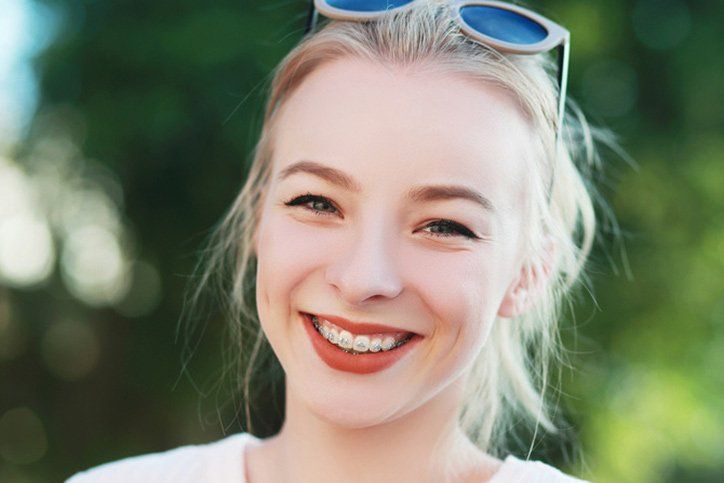 smiling girl wearing braces