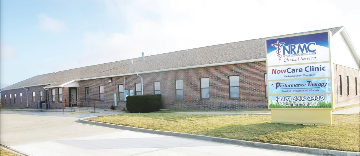Brick building with a sign for NRHC Family Clinic, an Urgent Care Clinic, and Pathways to Trust.