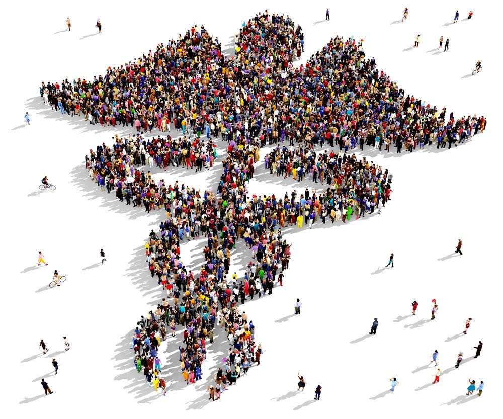 Crowd of people forming the medical symbol, Caduceus, on a white background.
