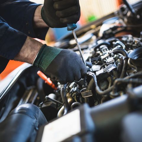 Mechanic Fixing Something on Car Engine — Fort Mill, SC — Toyota Techs Mechanic Fixing Something on Car Engine — Fort Mill, SC — Toyota Techs