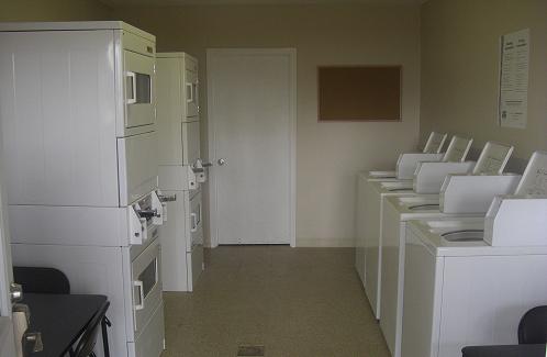A laundromat with a lot of washers and dryers