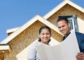 Couple Looking at the House Blueprint — Friendly Finance in Central City, KY