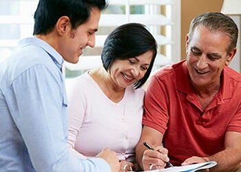 Financial Adviser Talking to a Senior Couple — Friendly Finance in Central City, KY