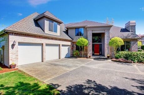 Large Modern House With Garage Spaces and Concrete Driveway — Cross Concrete Construction Inc in East Moline, IL Large Modern House With Garage Spaces and Concrete Driveway — Cross Concrete Construction Inc in East Moline, IL