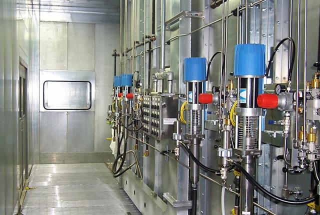 A room with a lot of pipes and valves in it