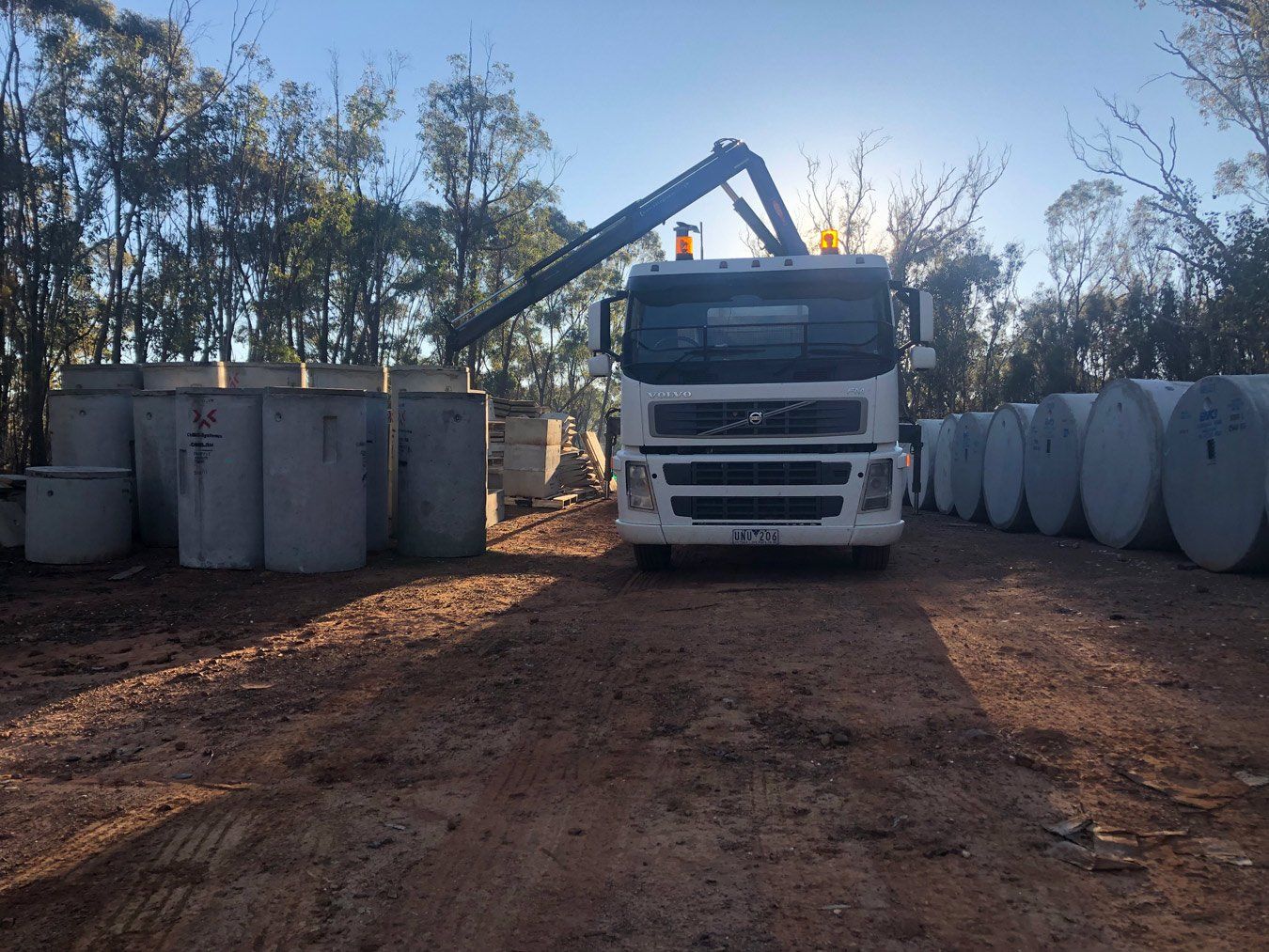 septic tanks with and a white truck