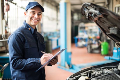 Mechanic With Checklist — Peter Mac's Service Centre in Budgewoi, NSW Mechanic With Checklist — Peter Mac's Service Centre in Budgewoi, NSW