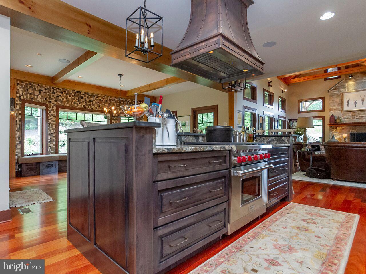 There is a large island in the middle of the kitchen.
