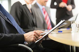 business people seated around a table