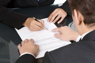 attorney and client reviewing document together