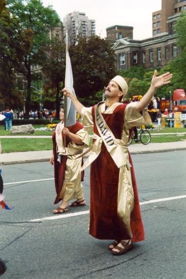 A man wearing a sash that says miss new york