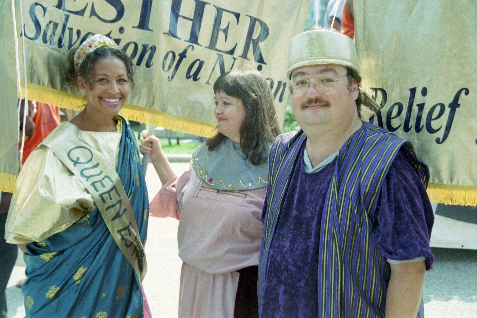 A group of people standing in front of a banner that says relief