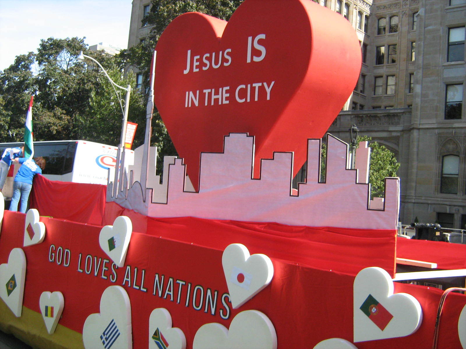 A float that says jesus is in the city