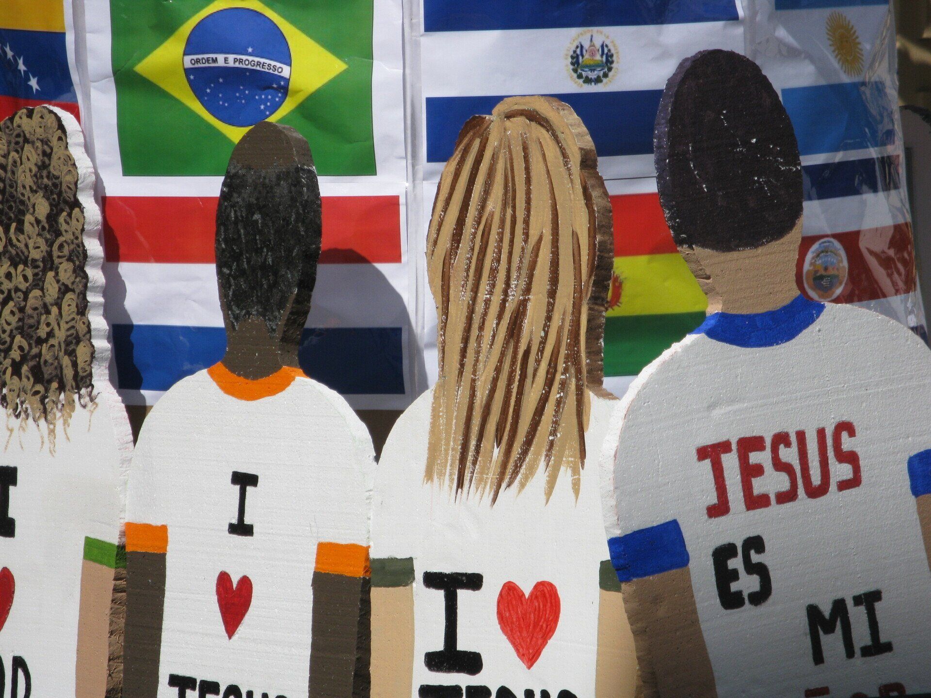 A group of people wearing shirts that say i love jesus