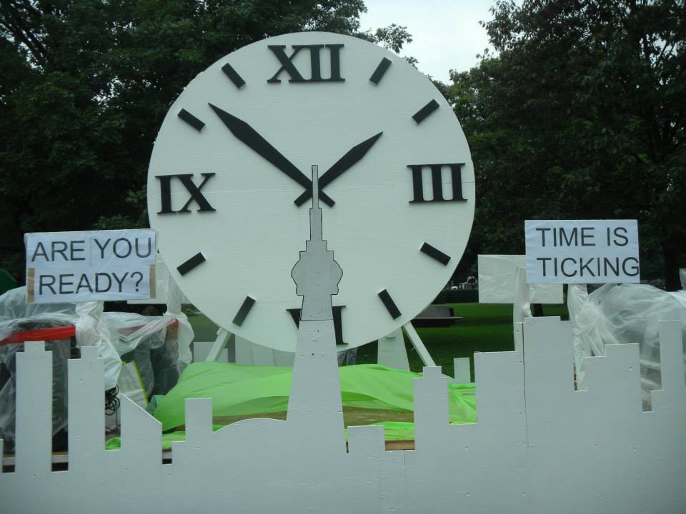 A clock with a sign that says time is ticking