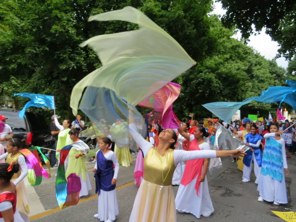 A group of people holding flags in a parade