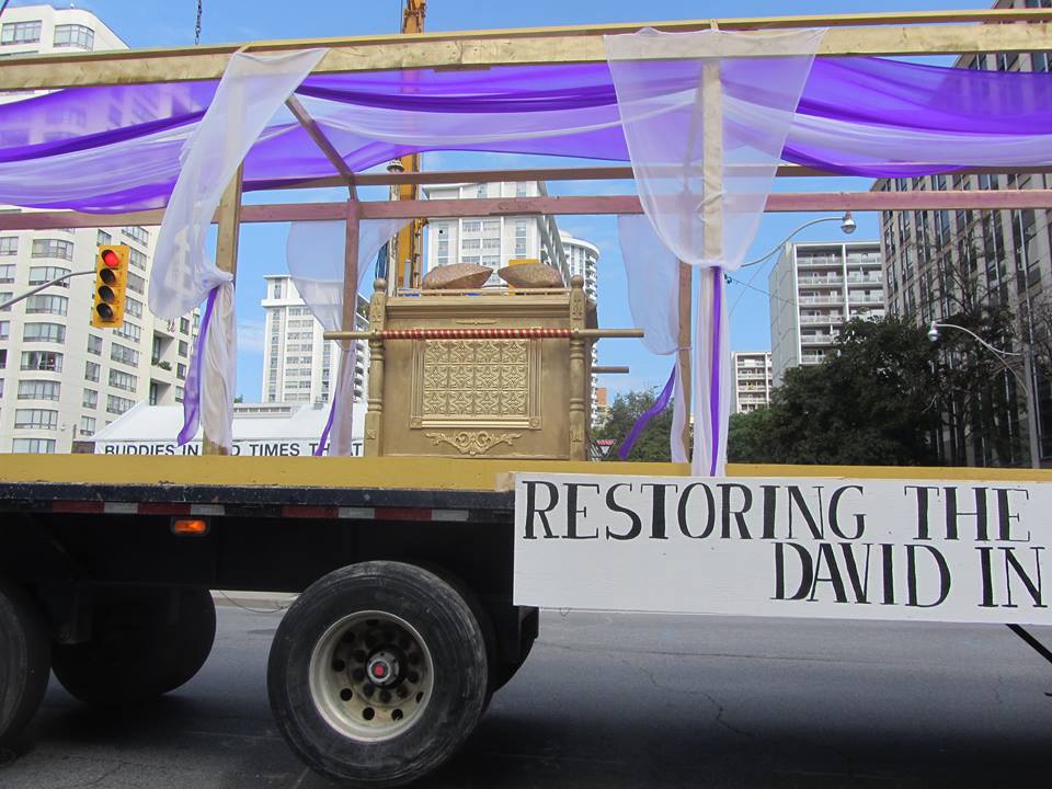 A truck with a sign that says restoring the david in it
