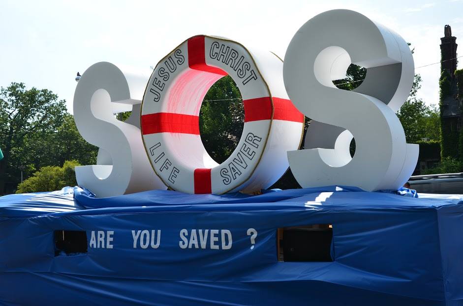A large sos sign with a life preserver in the middle