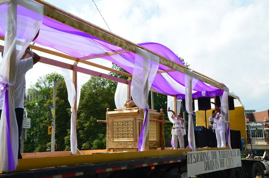 A purple and white float with the word bride on it