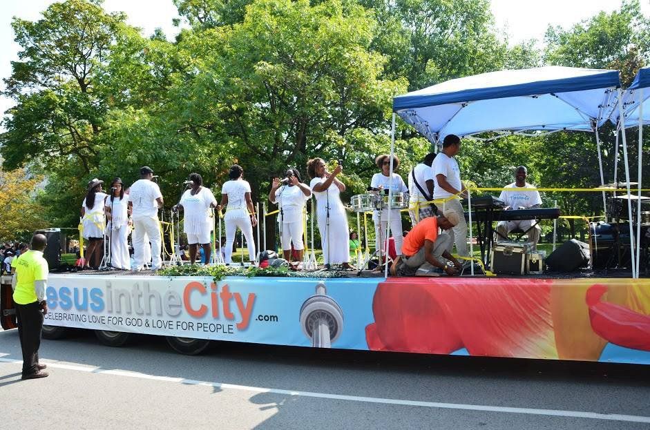 Jesus in the city is written on the side of a float