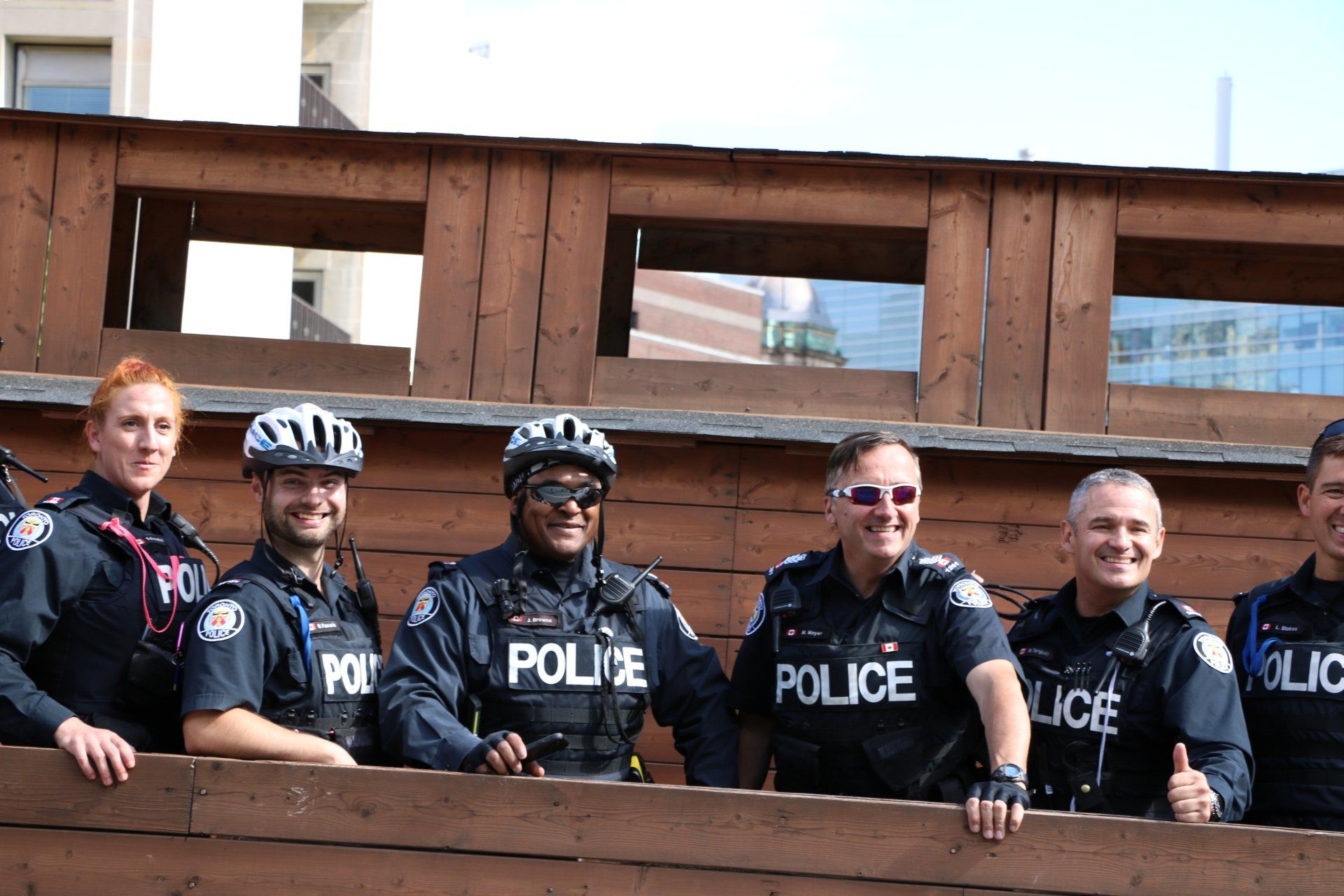 A group of police officers are posing for a picture.