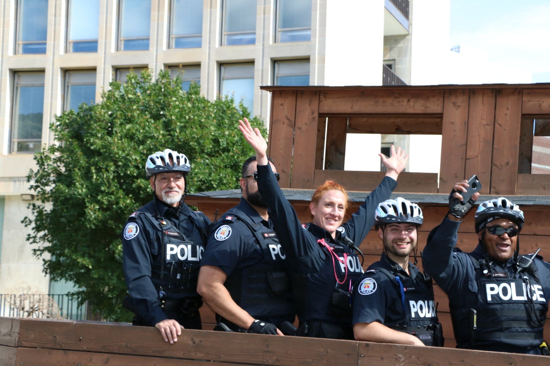 A group of police officers are standing next to each other