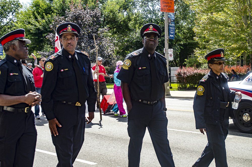 A group of police officers are walking down the street