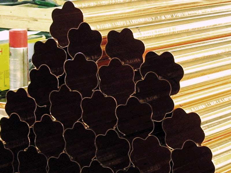A bunch of metal pipes stacked on top of each other