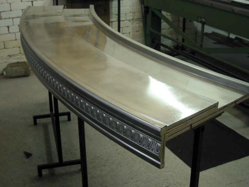 A curved piece of metal is sitting on a table