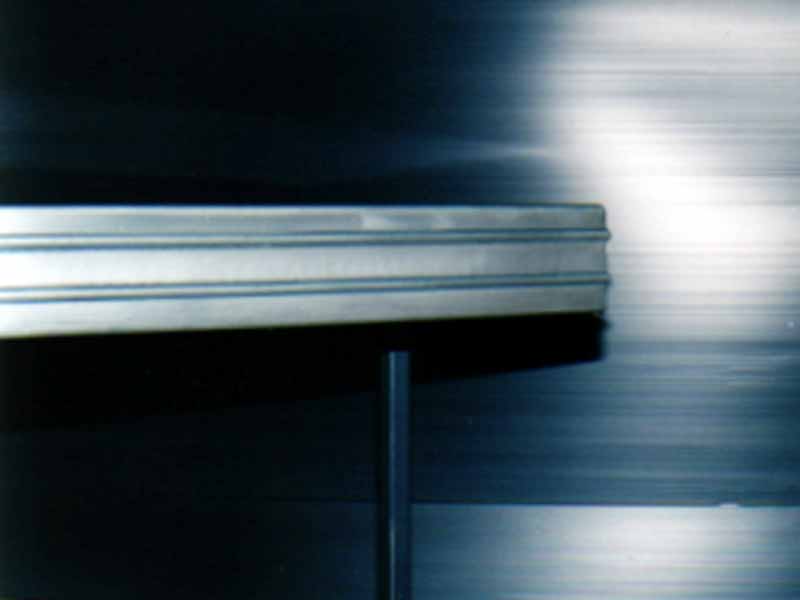 A stainless steel table with a black background