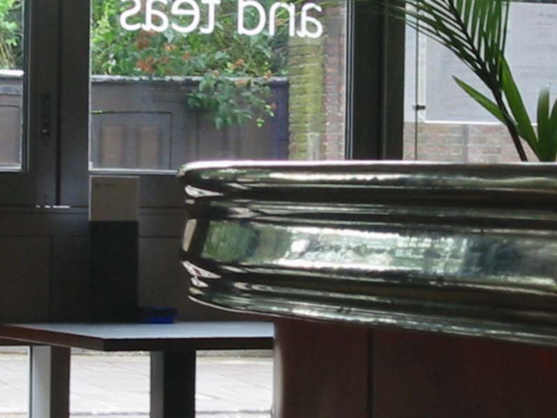 A potted plant sits in front of a window with the number 2691 on it