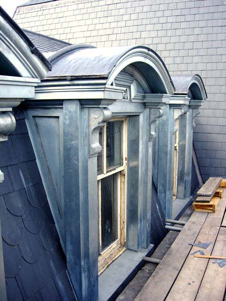 A row of arched windows on the side of a building