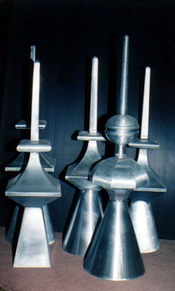 A group of metal sculptures are sitting on a table.