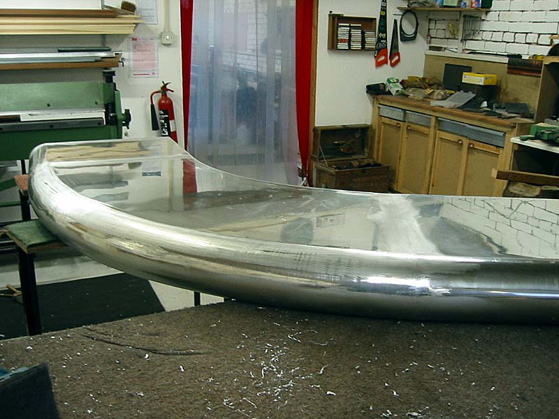 A large piece of metal is sitting on a table in a room