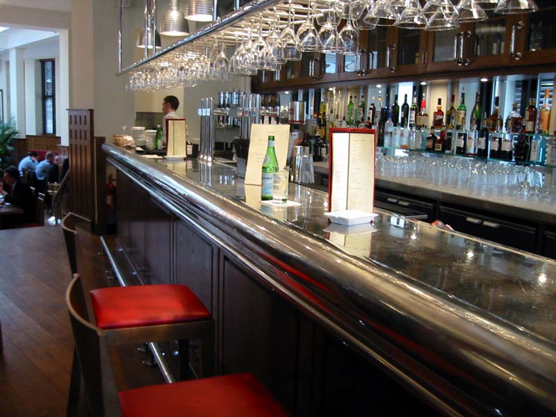 A bar with a bottle of water on the counter