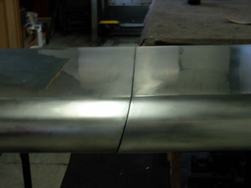 A piece of metal is sitting on a table in a room.
