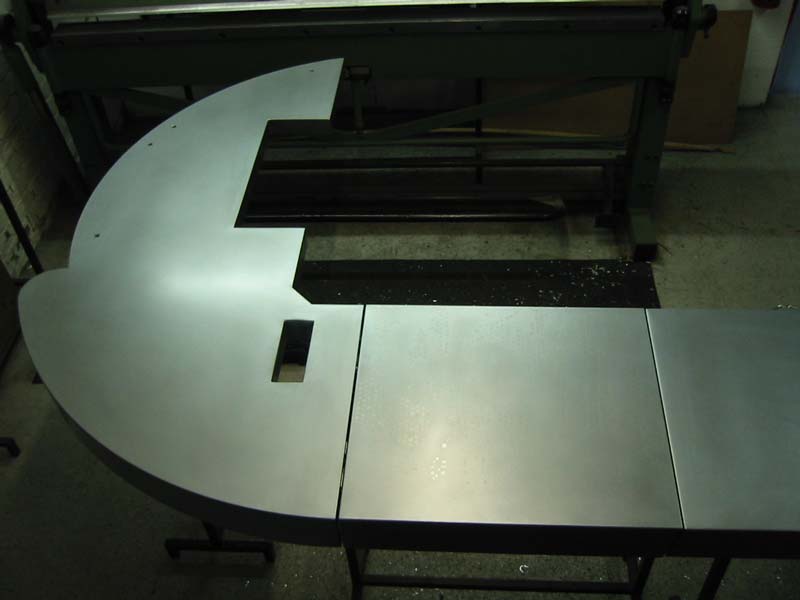 A metal table with a hole in the middle of it