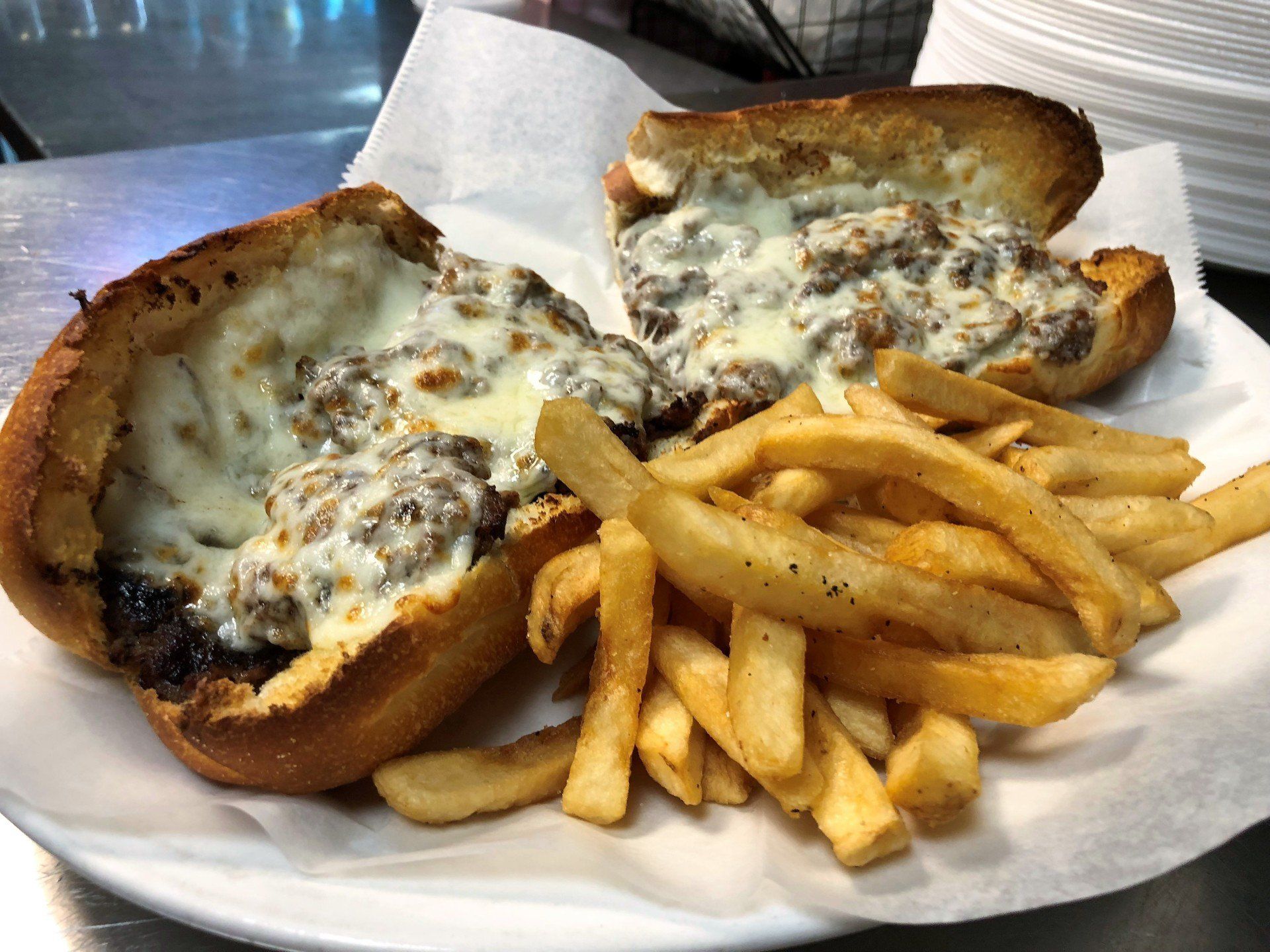 Big Louie’s Pizzeria cheesesteak sandwich with fries