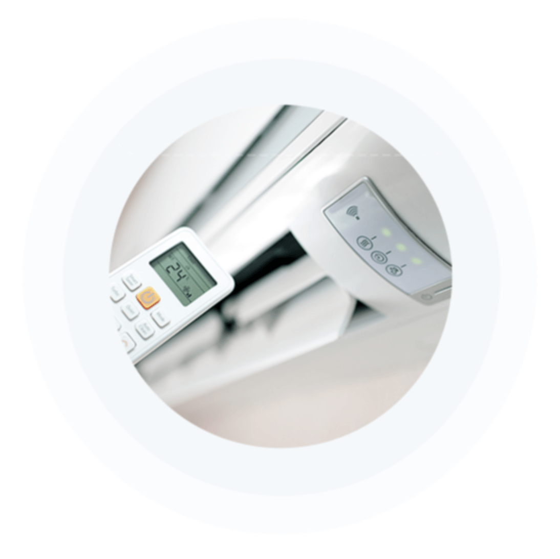 A close up of a remote control for an air conditioner