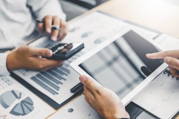 Two Man Discussing New Plan Financial Graph Data — Elizabethton, TN — Southern Finance Two Man Discussing New Plan Financial Graph Data — Elizabethton, TN — Southern Finance