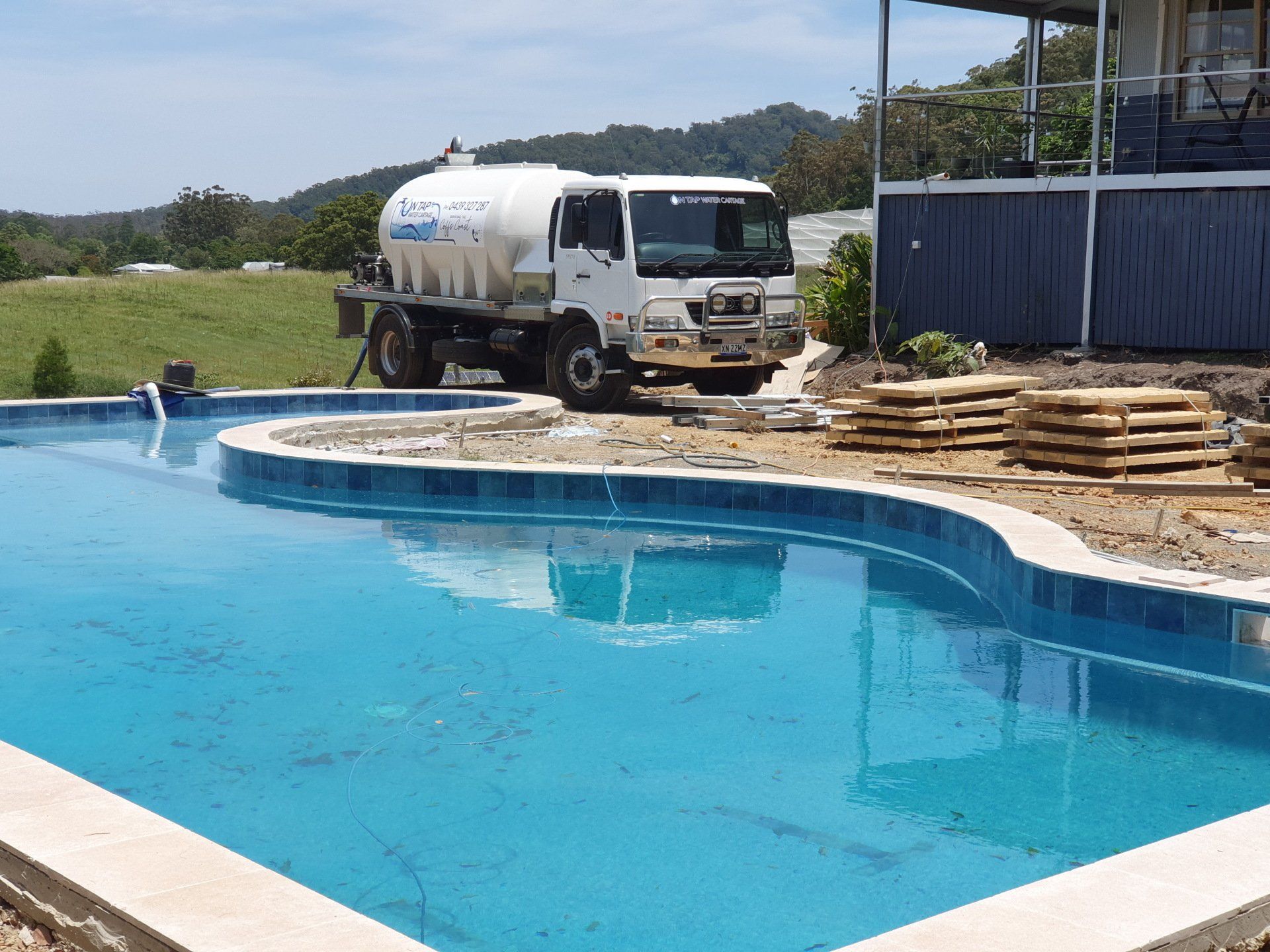 Filling Swimming Pool — On Tap Water Cartage in Coffs Harbour, NSW