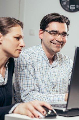 Photo of two people enjoying during work — Advanced Alarm Company, Colorado Springs CO 80907, USA Photo of two people enjoying during work — Advanced Alarm Company, Colorado Springs CO 80907, USA