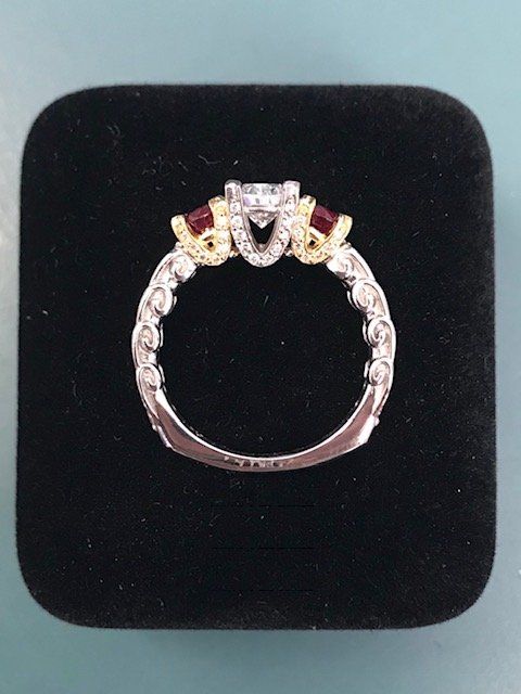A ring is sitting in a black velvet box