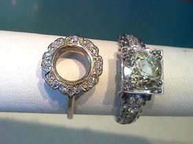 Two rings are sitting on a person 's finger.