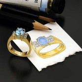 A couple of rings sitting on top of a piece of paper.